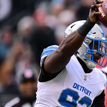 Detroit Lions defensive end Josh Paschal (93) celebrates his fumble recovery against the Chicago Bears