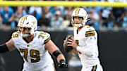 Nov 9, 2025; Charlotte, North Carolina, USA;  New Orleans Saints quarterback Tyler Shough (6) looks to pass as center Luke Fortner (79) blocks in the fourth quarter at Bank of America Stadium. Mandatory Credit: Bob Donnan-Imagn Images