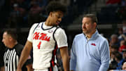 Jan 4, 2025; Oxford, Mississippi, USA; Mississippi Rebels head coach Chris Beard (right) talks with forward Jaemyn Brakefield (4) during the second half against the Georgia Bulldogs at The Sandy and John Black Pavilion at Ole Miss. Mandatory Credit: Petre Thomas-Imagn Images