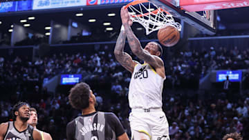Dec 21, 2024; Brooklyn, New York, USA;  Utah Jazz forward John Collins (20) dunks against the Brooklyn Nets in the third quarter at Barclays Center. Mandatory Credit: Wendell Cruz-Imagn Images