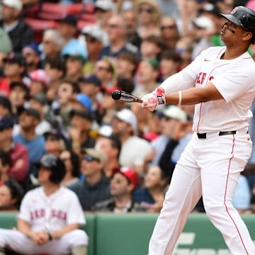 Boston Red Sox designated hitter Rafael Devers (11) hits a grand slam during the third inning against the Atlanta Braves at Fenway Park on May 18.