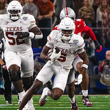 Texas Longhorns receiver Ryan Wingo (5) runs the ball during the College Football Playoff semifinal game against Ohio State in the Cotton Bowl at AT&T Stadium on Friday, Jan. 10, 2024 in Arlington, Texas.
