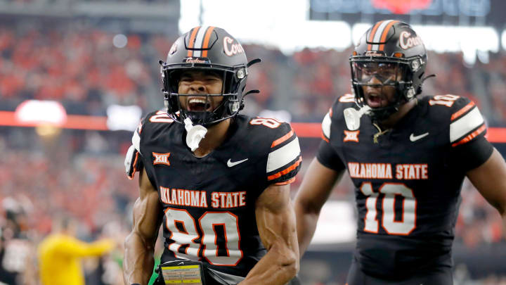 Big 12: Oklahoma State's Brennan Presley (80) celebrates his touchdown in the first half against the Texas Longhorns.