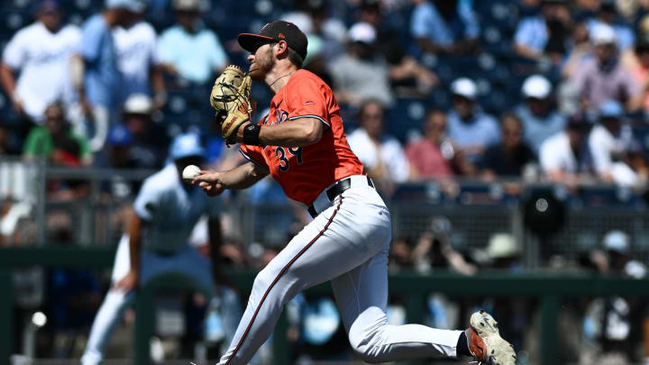 Jun 14, 2024; Omaha, NE, USA;  Virginia Cavaliers pitcher Chase Hungate (39) throws against the North Carolina Tar Heels during the seventh inning at Charles Schwab Filed Omaha. Mandatory Credit: Steven Branscombe-USA TODAY Sports