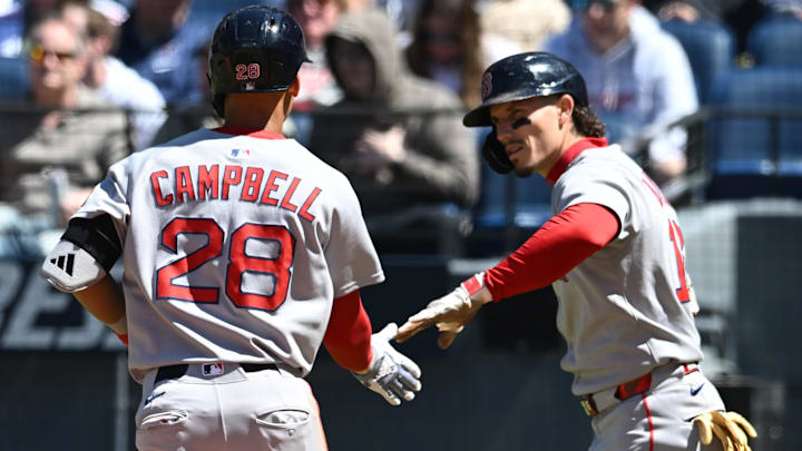 Cleveland, Ohio, USA; Boston Red Sox second baseman Kristian Campbell (28) celebrates with left fielder Jarren Duran (16) after scoring during the fourth inning against the Cleveland Guardians at Progressive Field.