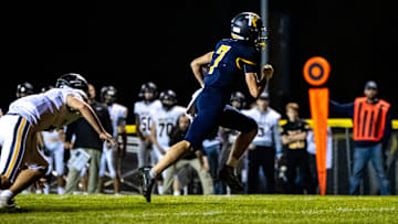 Iowa City Regina's Jackson Naeve (7) runs into the end zone for a touchdown during a first round Class 1A high school football playoff game against Eddyville-Blakesburg-Fremont, Friday, Oct. 20, 2023, at Regina Catholic High School in Iowa City, Iowa.