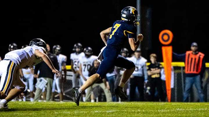 Iowa City Regina's Jackson Naeve (7) runs into the end zone for a touchdown during a first round Class 1A high school football playoff game against Eddyville-Blakesburg-Fremont, Friday, Oct. 20, 2023, at Regina Catholic High School in Iowa City, Iowa.