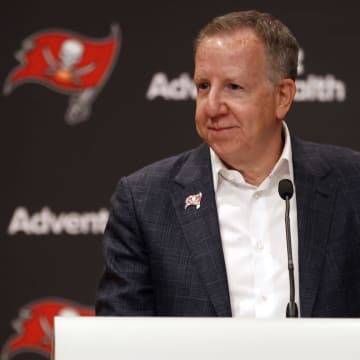 Jul 14, 2021; Tampa, Florida, USA; Tampa Bay Buccaneers owner/co-chairman Bryan Glazer speaks during a press conference to announce that former defensive coordinator Monte Kiffin (not pictured) will be entered into the Tampa Bay Buccaneers-Ring of Honor at AdventHealth Training Center. Mandatory Credit: Kim Klement-USA TODAY Sports