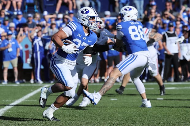 BYU running back LJ Martin rushes with the ball against the Arizona Wildcats.