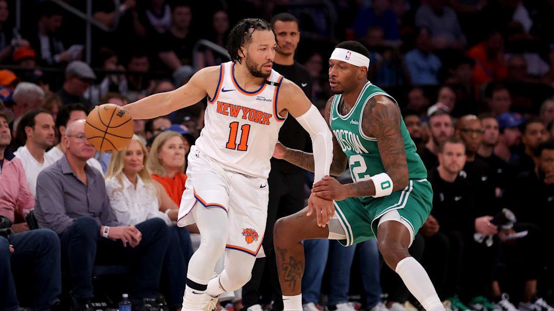 New York Knicks guard Jalen Brunson controls the ball against Boston Celtics forward Torrey Craig. Mandatory Credit: Brad Penner-Imagn Images