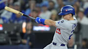 Oct 31, 2025; Toronto, Ontario, CAN; Los Angeles Dodgers second baseman Tommy Edman (25) hits a double in the third inning against the Toronto Blue Jays during game six of the 2025 MLB World Series at Rogers Centre. Mandatory Credit: John E. Sokolowski-Imagn Images