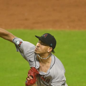 Aug 5, 2024; Cleveland, Ohio, USA; Arizona Diamondbacks relief pitcher Justin Martinez (63) delivers a pitch in the tenth inning against the Cleveland Guardians at Progressive Field. Mandatory Credit: David Richard-USA TODAY Sports