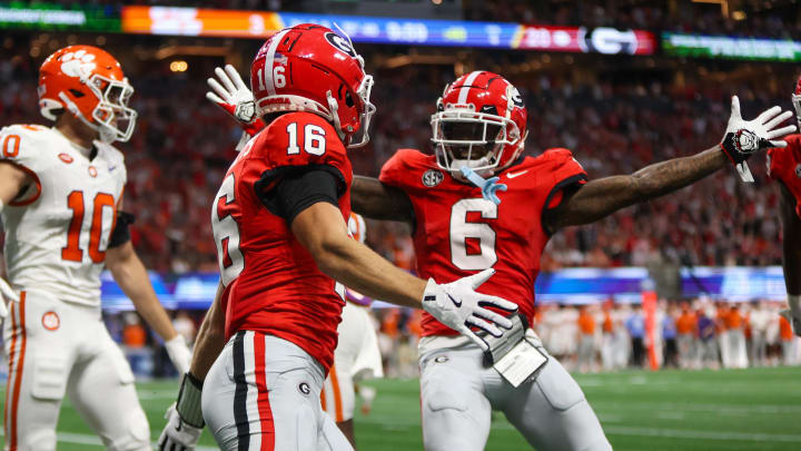 Aug 31, 2024; Atlanta, Georgia, USA; Georgia Bulldogs wide receiver London Humphreys (16) celebrates after a touchdown with wide receiver Dominic Lovett (6) against the Clemson Tigers in the third quarter at Mercedes-Benz Stadium. Mandatory Credit: Brett Davis-USA TODAY Sports