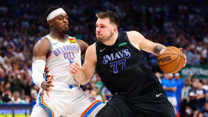 May 18, 2024; Dallas, Texas, USA;  Dallas Mavericks guard Luka Doncic (77) controls the ball as Oklahoma City Thunder guard Luguentz Dort (5) defends during the second half in game six of the second round of the 2024 NBA playoffs at American Airlines Center. Mandatory Credit: Kevin Jairaj-USA TODAY Sports