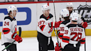 Feb 21, 2021; Washington, District of Columbia, USA; New Jersey Devils left wing Nikita Gusev (97) celebrates with teammates after scoring a goal against the Washington Capitals in the third period at Capital One Arena. Mandatory Credit: Geoff Burke-Imagn Images