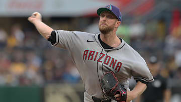 Jul 26, 2025; Pittsburgh, Pennsylvania, USA;  Arizona Diamondbacks starting pitcher Merrill Kelly (29) delivers a pitch against the Pittsburgh Pirates during the first inning at PNC Park. Mandatory Credit: Charles LeClaire-Imagn Images