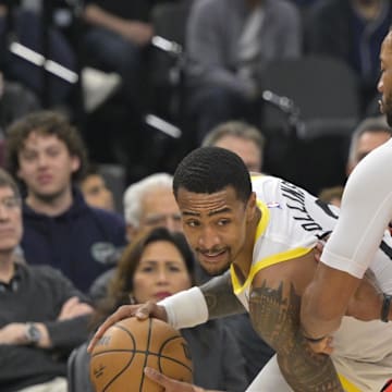 Dec 16, 2024; Inglewood, California, USA;  Utah Jazz forward John Collins (20) is defended by Los Angeles Clippers guard Norman Powell (24) in the first half at Intuit Dome. Mandatory Credit: Jayne Kamin-Oncea-Imagn Images