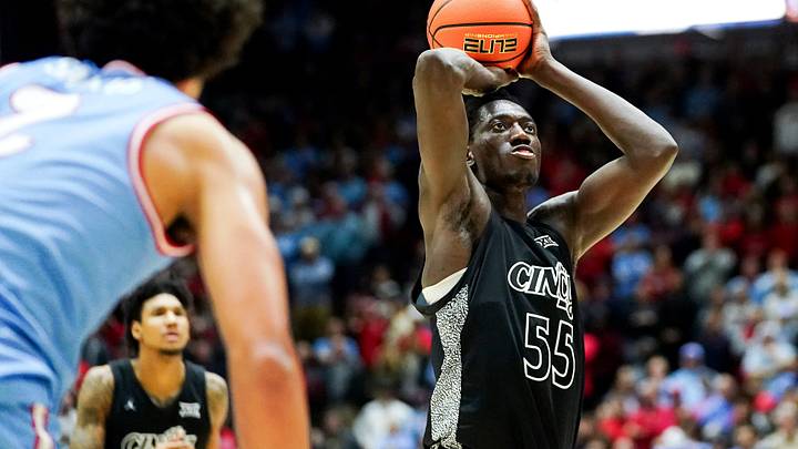 Cincinnati Bearcats forward Aziz Bandaogo (55) hits a free-throw shot in the second half of a NCAA men’s basketball game between the Cincinnati Bearcats and Dayton Flyers, Friday, Dec. 20, 2024, at Heritage Bank Center in downtown Cincinnati. Bearcats won 66-59.