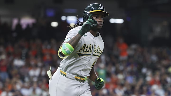 Lawrence Butler celebrates his home run.