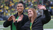 Former Oregon women basketball players Satou Sabally, left, and Sabrina Ionescu are introduced during the Oregon Colorado Saturday Oct. 30, 2021.