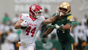 Houston Cougars running back Dean Connors (44) carries the ball against Baylor Bears safety Micah Gifford (24) during the second half at McLane Stadium. 