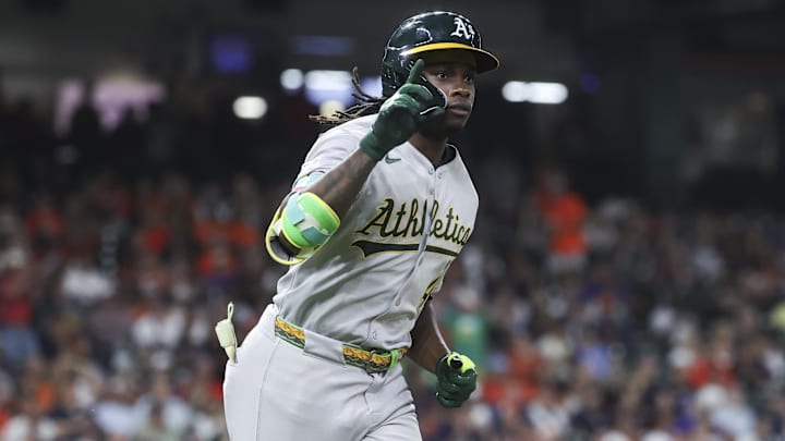 Athletics center fielder Lawrence Butler rounds the bases after hitting a home run during the ninth inning. Athletics center fielder Lawrence Butler rounds the bases after hitting a home run during the ninth inning.