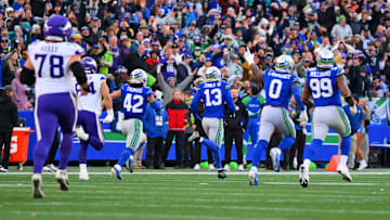 Nov 30, 2025; Seattle, Washington, USA; Seattle Seahawks linebacker Ernest Jones IV (13) runs back for an interception during the first half against the Minnesota Vikings at Lumen Field.