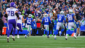 Nov 30, 2025; Seattle, Washington, USA; Seattle Seahawks linebacker Ernest Jones IV (13) runs back for an interception during the first half against the Minnesota Vikings at Lumen Field. Mandatory Credit: Steven Bisig-Imagn Images