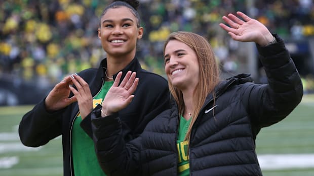 Former Oregon women's basketball players Satou Sabally and Sabrina Ionescu are introduced during the Oregon-Colorado game.