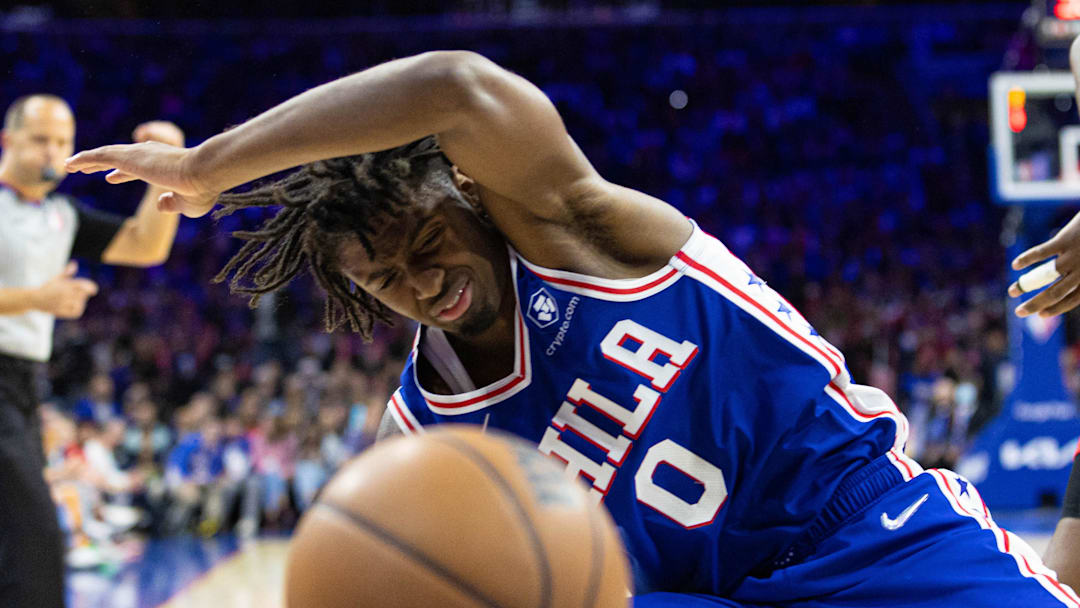 Apr 25, 2022; Philadelphia, Pennsylvania, USA; Philadelphia 76ers guard Tyrese Maxey (0) falls to the floor after a collision during the third quarter in game five of the first round for the 2022 NBA playoffs against the Toronto Raptors at Wells Fargo Center. Mandatory Credit: Bill Streicher-Imagn Images