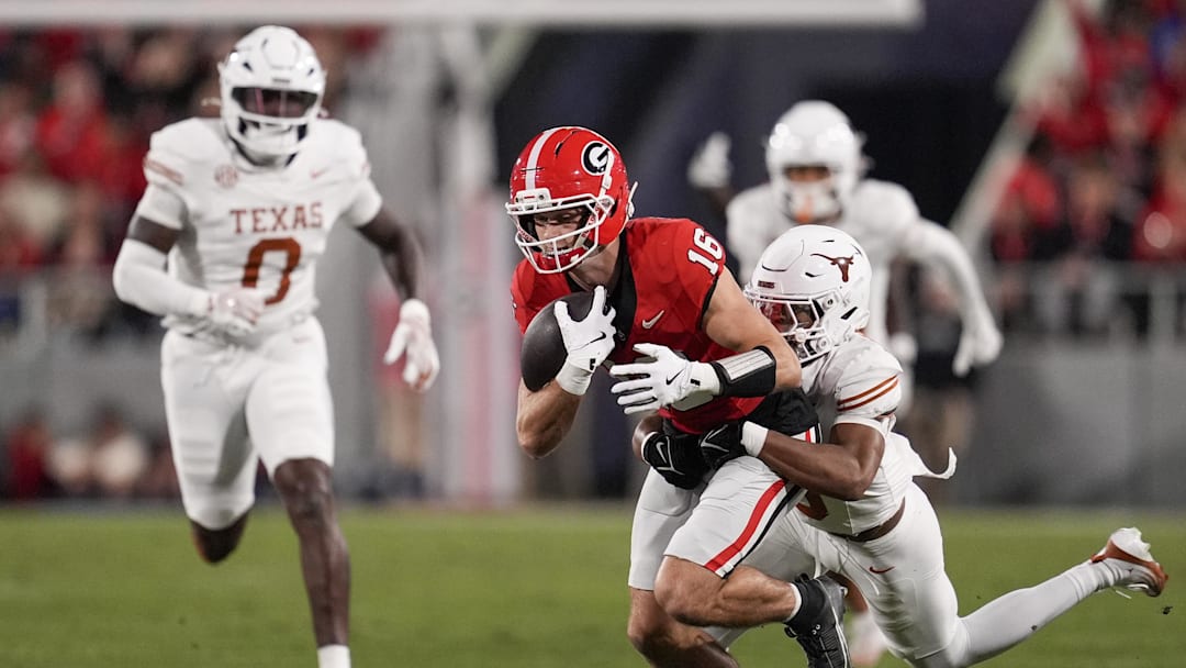 Texas Longhorns defensive back Jonah Williams (9) tackles Georgia Bulldogs wide receiver London Humphreys (16).