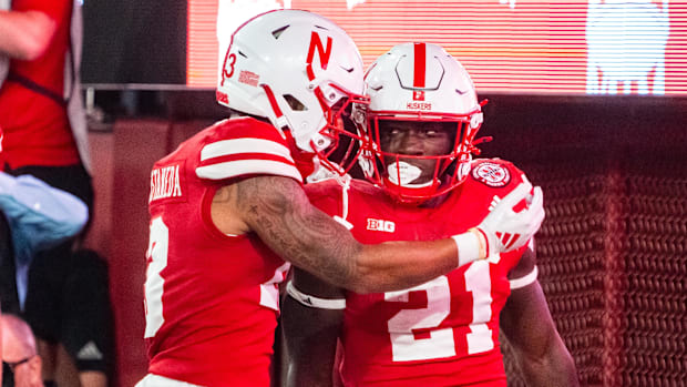 Nebraska Cornhuskers running back Emmett Johnson (21) and wide receiver Isaiah Garcia-Castaneda (13) celebrate after a touchd