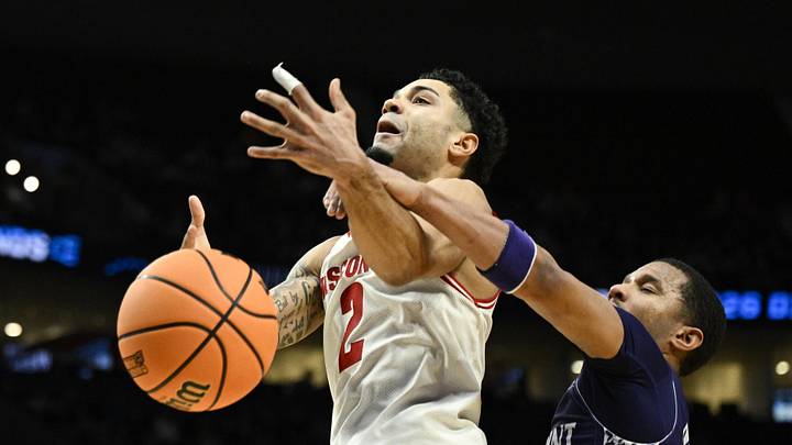 Mar 19, 2026; Portland, OR, USA; High Point Panthers guard Rob Martin (3) knocks the ball away from Wisconsin Badgers guard Nick Boyd (2) during the second half of a first round game of the men's 2026 NCAA Tournament at Moda Center. Mandatory Credit: Troy Wayrynen-Imagn Images
