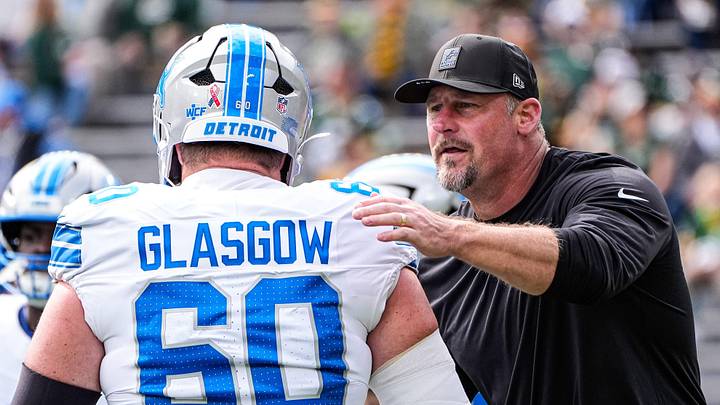 Detroit Lions head coach Dan Campbell shakes hands with guard Graham Glasgow (60) at warm up at Lambeau Field in Green Bay, Wis., on Sunday, September 7, 2025.