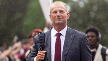 Aug 31, 2024; Tuscaloosa, Alabama, USA;  Fans watch as Alabama Crimson Tide head coach Kalen DeBoer walks down the Walk of Champions with his team outside of Bryant-Denny Stadium. Mandatory Credit: Will McLelland-Imagn Images