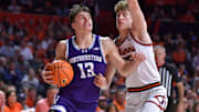 Northwestern Wildcats guard Brooks Barnhizer (13) drives the ball 