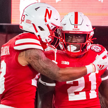 Sep 14, 2024; Lincoln, Nebraska, USA; Nebraska Cornhuskers running back Emmett Johnson (21) and wide receiver Isaiah Garcia-Castaneda (13) celebrate after a touchdown against the Northern Iowa Panthers during the fourth quarter at Memorial Stadium.