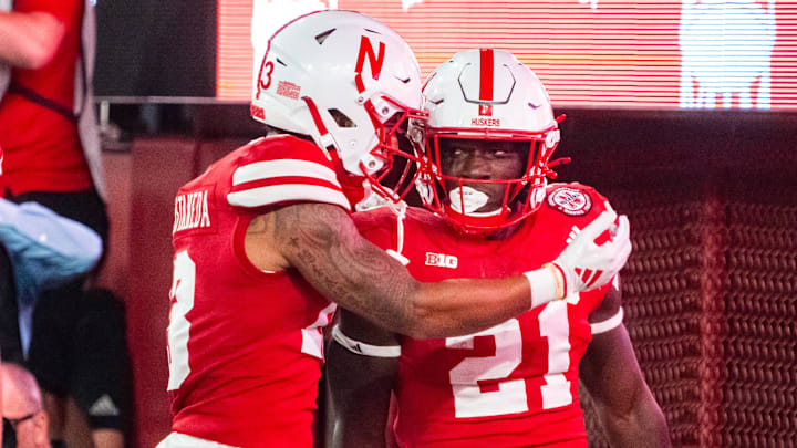 Sep 14, 2024; Lincoln, Nebraska, USA; Nebraska Cornhuskers running back Emmett Johnson (21) and wide receiver Isaiah Garcia-Castaneda (13) celebrate after a touchdown against the Northern Iowa Panthers during the fourth quarter at Memorial Stadium.