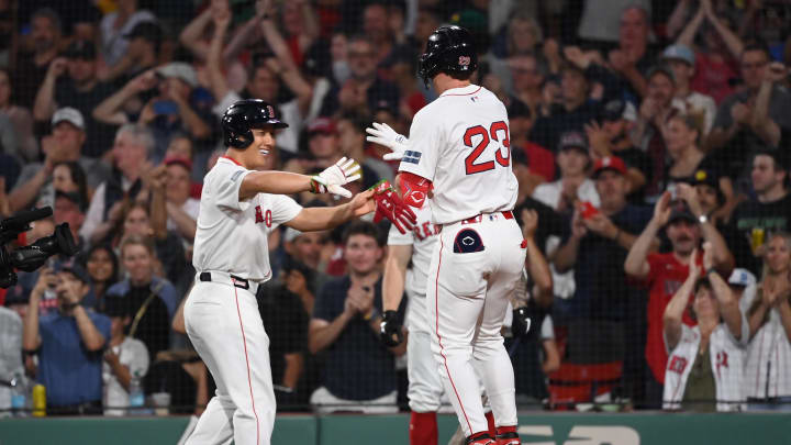 Jul 29, 2024; Boston, Massachusetts, USA; Boston Red Sox shortstop Romy Gonzalez (23) celebrates his two run home run with designated hitter Masataka Yoshida (7) during the sixth inning against the Seattle Mariners at Fenway Park. Mandatory Credit: Eric Canha-USA TODAY Sports