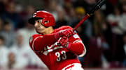 Cincinnati Reds first baseman Christian Encarnacion-Strand (33) hits a RBI double in the seventh inning of the MLB game between Cincinnati Reds and Seattle Mariners at Great American Ball Park in Cincinnati on Wednesday, April 16, 2025.