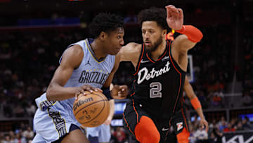 Apr 1, 2024; Detroit, Michigan, USA;  Memphis Grizzlies forward GG Jackson (45) dribbles defended by Detroit Pistons guard Cade Cunningham (2): Rick Osentoski-Imagn Images