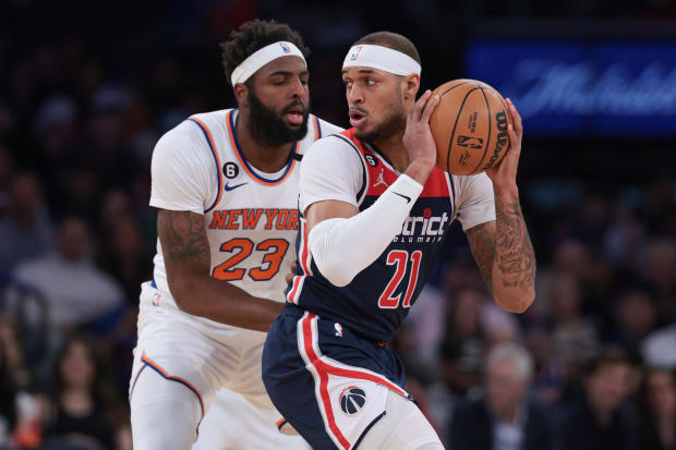 Apr 2, 2023; New York, New York, USA;  Washington Wizards center Daniel Gafford (21) is guarded by New York Knicks center Mitchell Robinson (23) during the first quarter at Madison Square Garden. Mandatory Credit: Vincent Carchietta-USA TODAY Sports