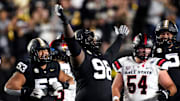 Vanderbilt defensive lineman De'Marion Thomas (98) celebrates sacking Ball State quarterback Kadin Semonza (3) during the second quarter at FirstBank Stadium in Nashville, Tenn., Saturday, Oct. 19, 2024.