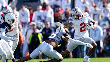 Ohio State Buckeyes wide receiver Emeka Egbuka (2) runs around Penn State Nittany Lions safety Zakee Wheatley (6) during the NCAA football game at Beaver Stadium in University Park, Pa. on Monday, Nov. 4, 2024. Ohio State won 20-13.