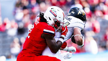 Oct 19, 2024; Tucson, Arizona, USA; Arizona Wildcats defensive lineman Chase Kennedy (11) tackles Colorado Buffaloes during the fourth quarter at Arizona Stadium. Mandatory Credit: Aryanna Frank-Imagn Images