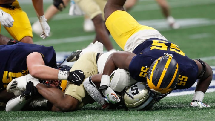 Prince Avenue's Christian Garrett (55) takes down Swainsboro's Demello Jones (1) during the GHSA high school football Class A-Division 1 championship game against Swainsboro at Mercedes-Benz Stadium in Atlanta, on Monday, Dec. 11, 2023.