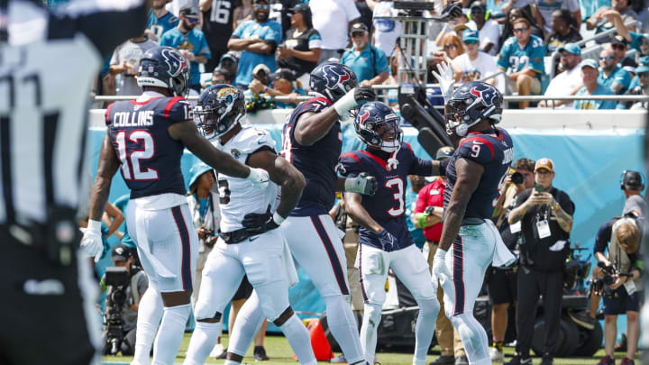 Sep 24, 2023; Jacksonville, Florida, USA; Houston Texans tight end Brevin Jordan (9), wide receiver Tank Dell (3), tackle Josh Jones (74) and wide receiver Nico Collins (12) celebrate a touchdown against the Jacksonville Jaguars during the second quarter at EverBank Stadium. Mandatory Credit: Morgan Tencza-USA TODAY Sports