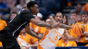 Tennessee Volunteers guard Zakai Zeigler (5) passes out of pressure from Mississippi State Bulldogs forward D.J. Jeffries (0) during their SEC Men's Basketball Tournament quarterfinal game at Bridgestone Arena in Nashville, Tenn., Friday, March 15, 2024.