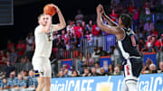 Mountaineers guard Tucker DeVries (12) shoots over Arizona Wildcats guard Jaden Bradley (0) during the second half at Imperial Arena at the Atlantis resort.