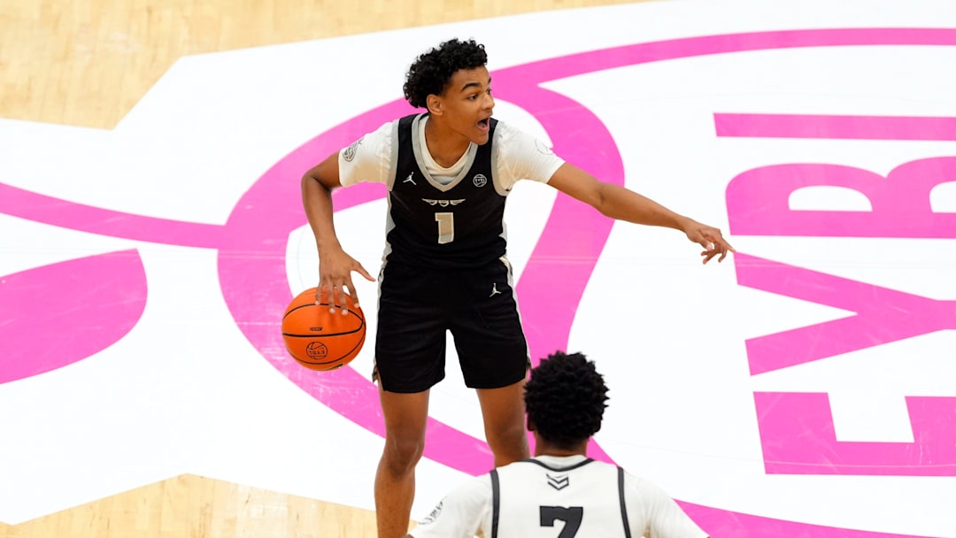 July 19, 2025; North Augusta, South Carolina, USA; Brad Beal Elite Quentin Coleman (1) gestures to a teammate as Team Durant Evans Barning Jr. (7) defends during the Brad Beal Elite and Team Durant game at the Nike EYBL Peach Jam at Riverview Park Activity Center. Brad Beal Elite won 91-59. Mandatory Credit: Katie Goodale - Augusta Chronicle/USA TODAY NETWORK
